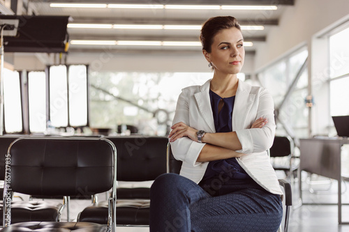 Beautiful businesswoman at the co-working is thinking