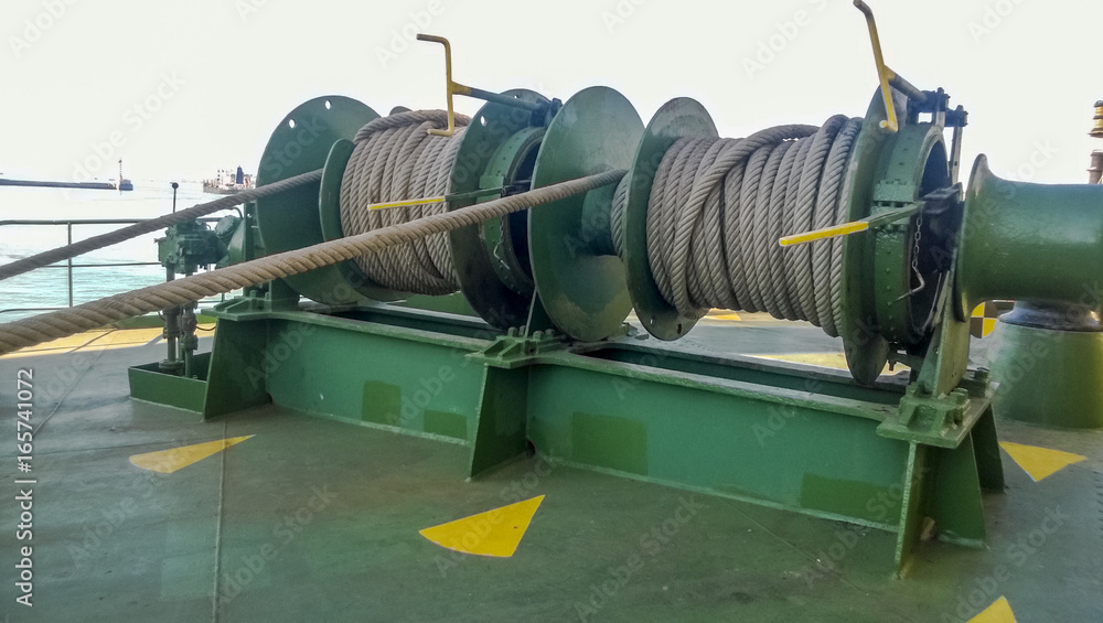 Mechanisms of tension control ropes. Winches. Equipment on the deck of a cargo ship or port Mechanisms of tension control ropes. Winches. Equipment on the deck of a cargo ship or port