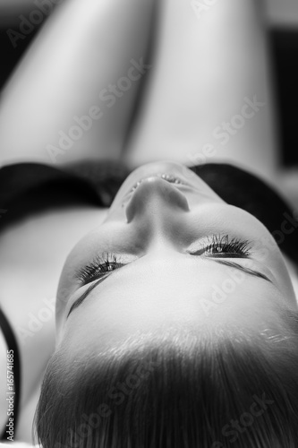 Tableau sur toile sensual beautiful girl in lingerie lying on bed looking up