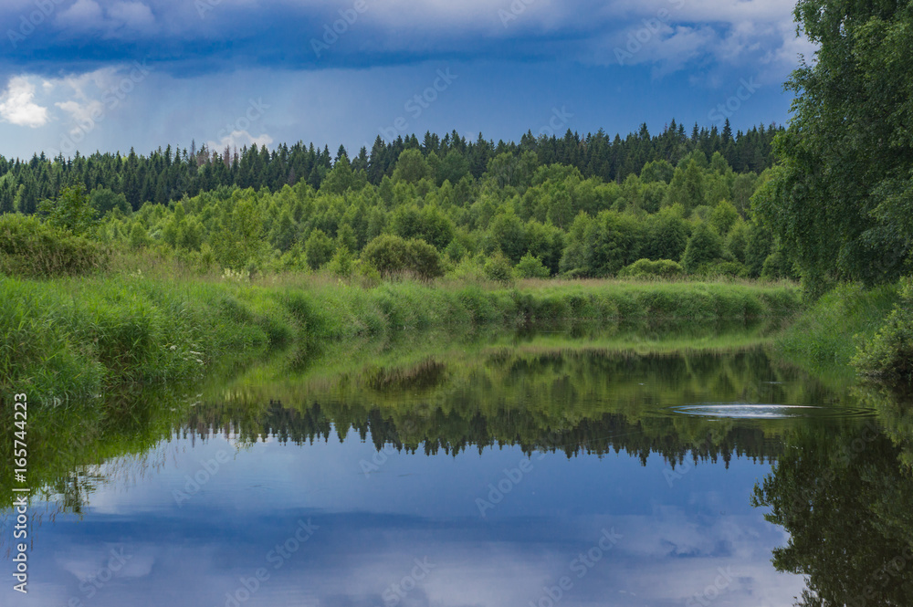 Fototapeta premium A wild river is approaching a thunderstorm