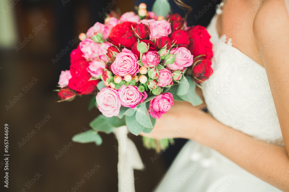 Beautiful luxury wedding bouquet of red flowers