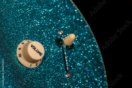 Fotografie Turn up the volume. Control knob from a sparkly glam rock guitar.