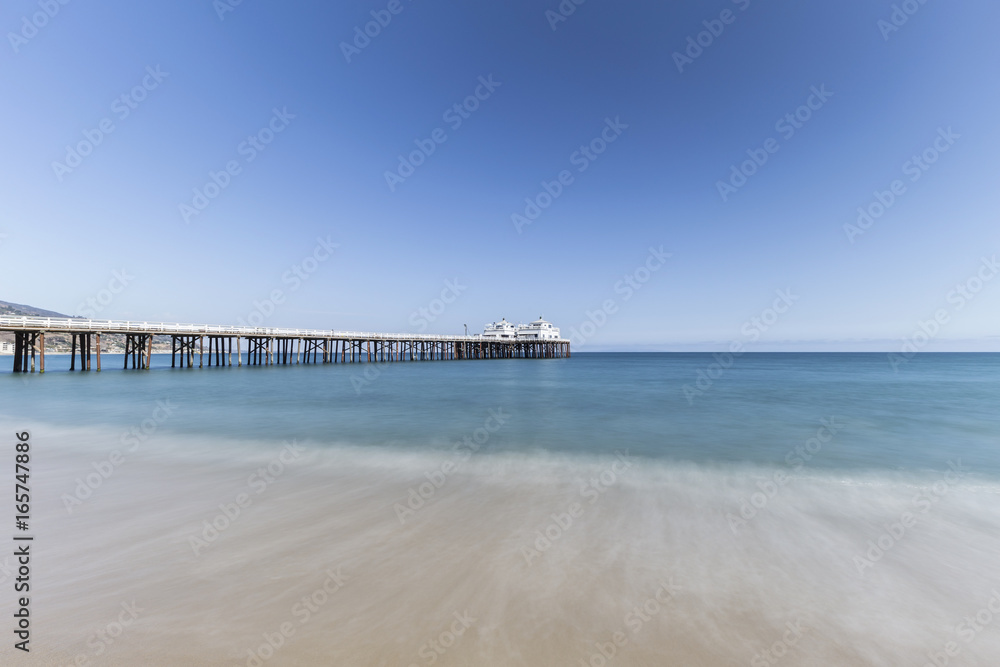 Malibu Pier with motion blur water near Los Angeles in Southern California.  