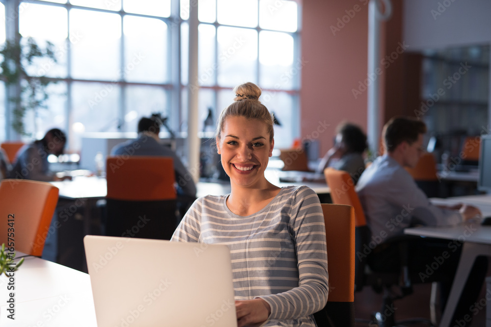 businesswoman using a laptop in startup office businesswoman using a laptop in startup office