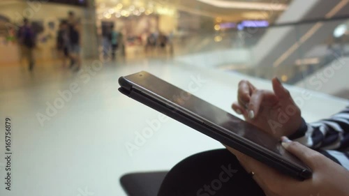 Wallpaper Mural woman use digital tablet in shopping mall close up shot Torontodigital.ca