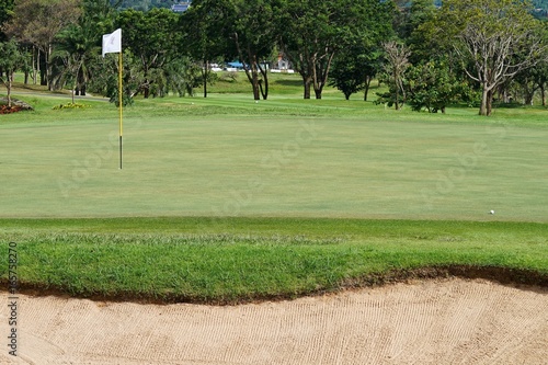 Golf course is a place to play sports. That requires money and specialized capabilities to design and build.