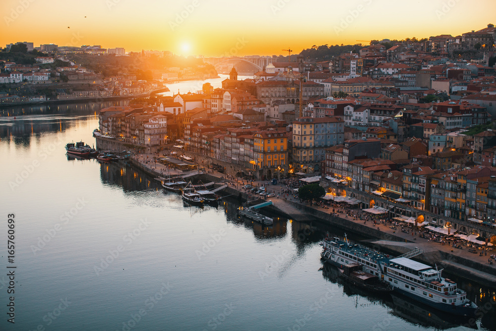 View of Ribeira on banks of Douro river during twilight, Porto, Portugal.