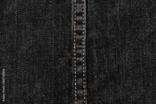 close up of black denim and stitches jeans texture for graphic design