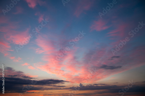 Romantic sunset sunrise sky with dark blue clouds