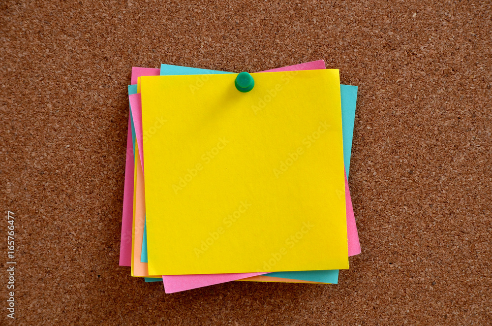 Blank notes pinned into brown corkboard Blank notes pinned into brown corkboard