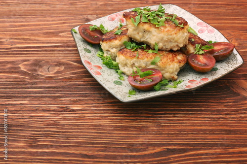 Chicken cutlets on wooden background