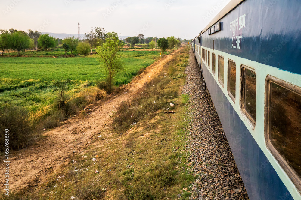 Indian train second class coach show while moving, india. Indian train second class coach show while moving, india.