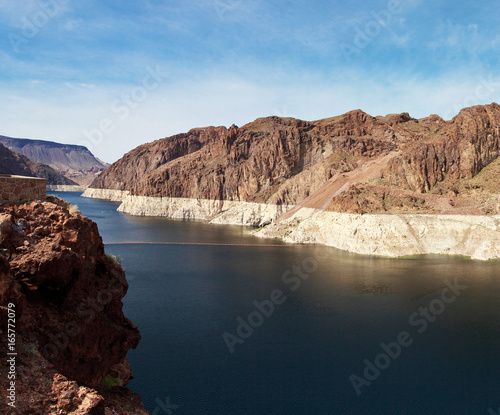 canyon rock cliff landscape with blue still water