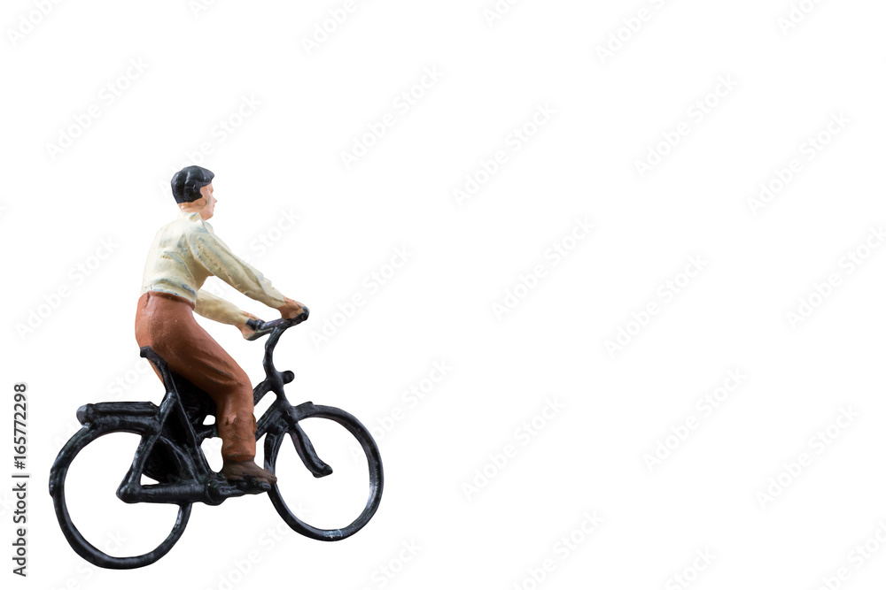 Fototapeta premium Miniature figure ride bicycle isolated on white background with clipping path