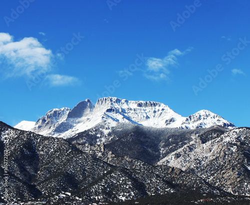 mountain peak with snow cold landscape blue sky