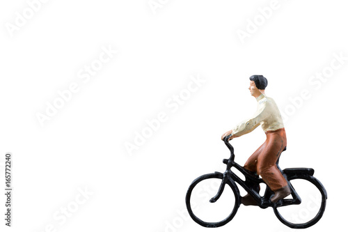 Miniature figure ride bicycle isolated on white background with clipping path