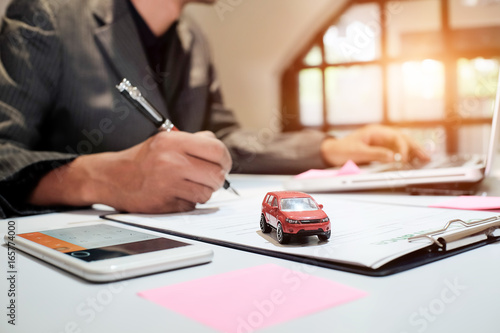 A Man Insurance broker offer protect your car , Insurance auto car concept and Insurance reimbursement vehicle Concept photo