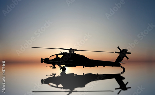 apache helicopter on the sun set photo