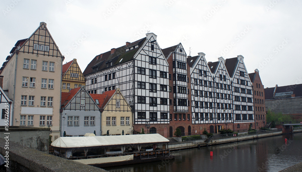 Facades of old houses near Motlava river, Gdansk, Poland