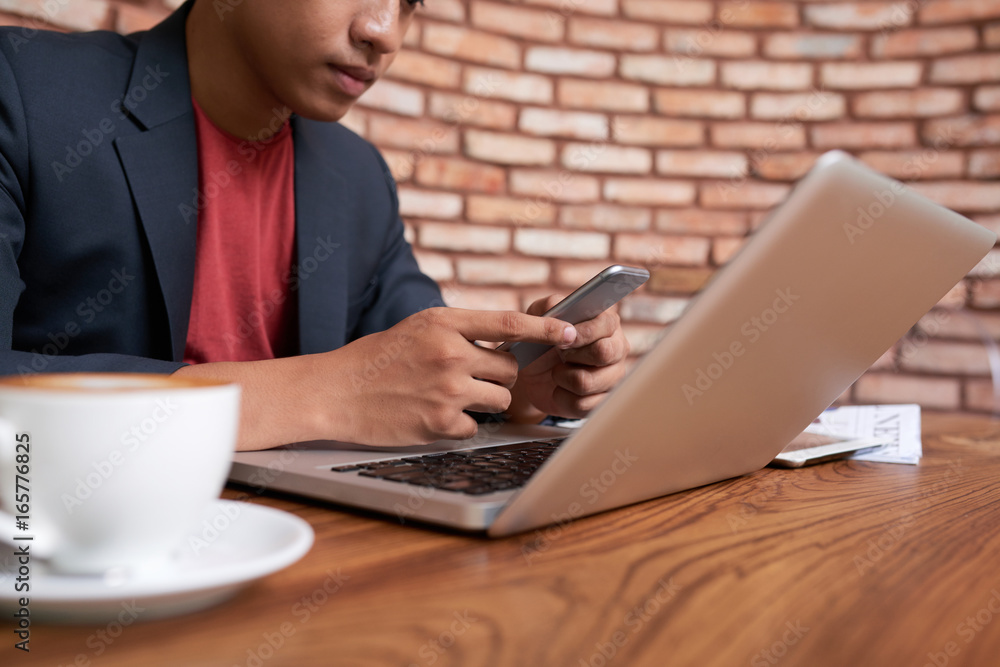 Young Asian Businessman Working in Cafe Young Asian Businessman Working in Cafe