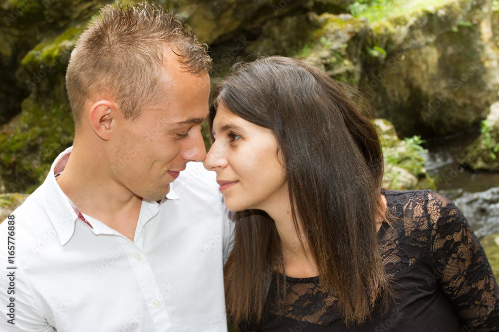 happy smiling young hippie couple hugging outdoors happy smiling young hippie couple hugging outdoors