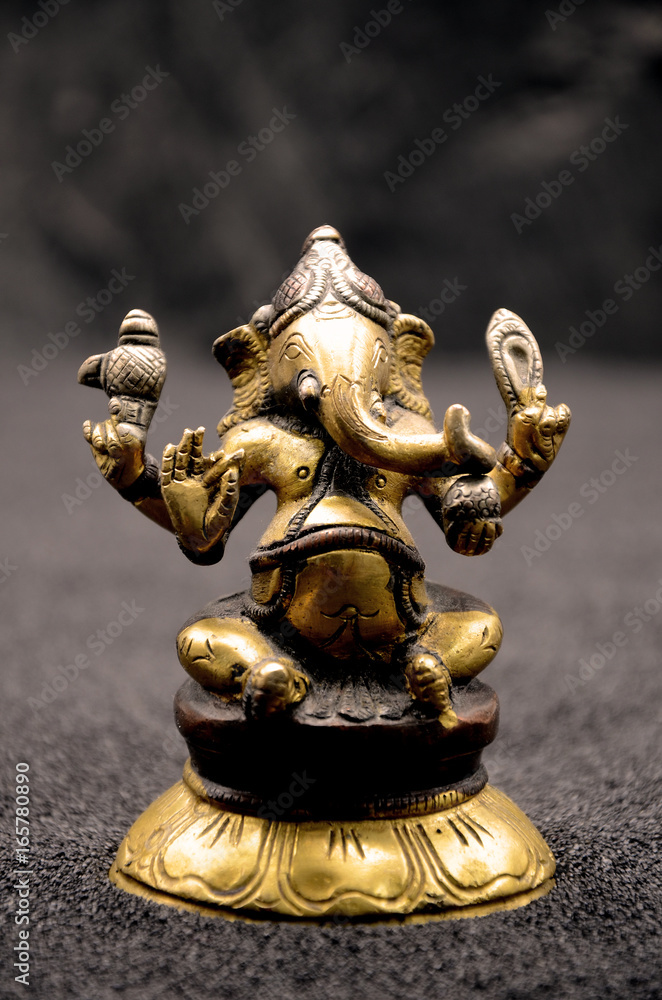 Ganesha on black background close up photo