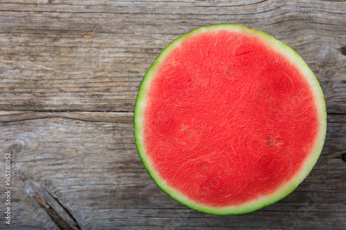 Fotografija Seedless watermelon on a wooden table - top view