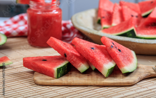 Watermelon slices on a wooden table