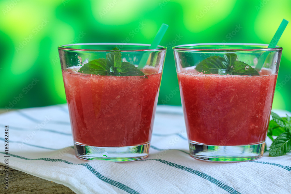Watermelon juices on a wooden table Watermelon juices on a wooden table