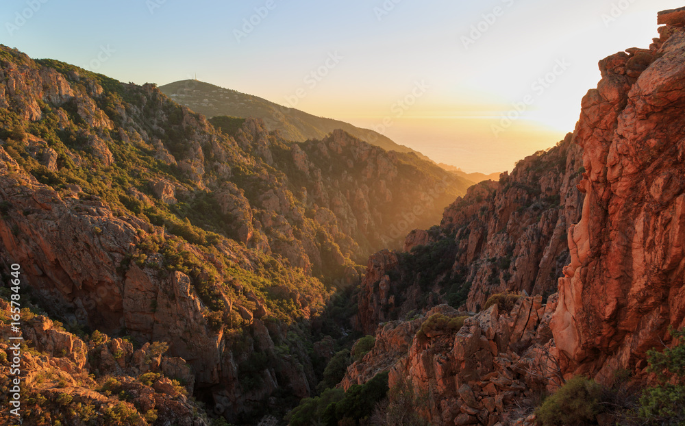 Last light at the famous cliffs of Calanche de Piana on Corsica, France. Last light at the famous cliffs of Calanche de Piana on Corsica, France.