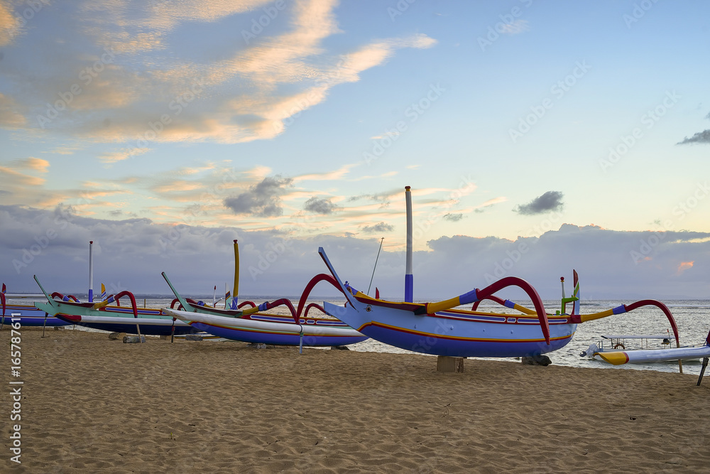 traditional fishing boats at the morning. Sanur Beach, Bali, Indonesia. traditional fishing boats at the morning. Sanur Beach, Bali, Indonesia.