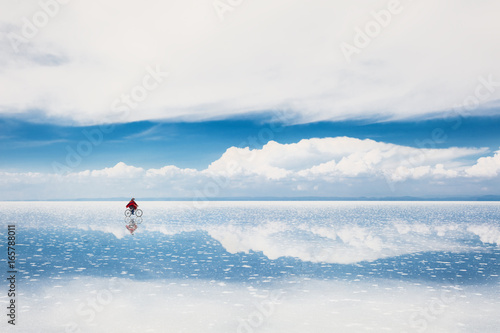 Mirror surface on the salt flat Salar de Uyuni, Altiplano, Bolivia photo