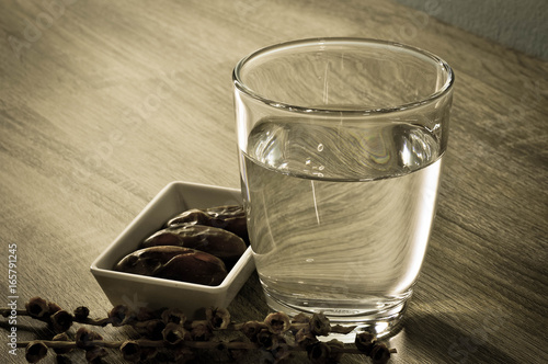 date palm and glass with water photo