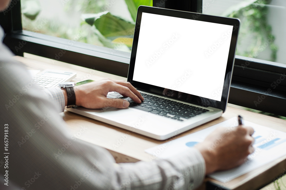 businessman using laptop with blank screen at cafe businessman using laptop with blank screen at cafe