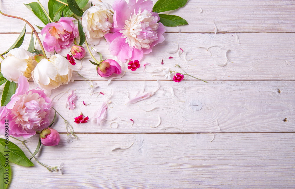 Stunning pink and white peonies on rustic wooden background. Copy space. Mother's, Valentines, Women's Wedding Day concept Stunning pink and white peonies on rustic wooden background. Copy space. Mother's, Valentines, Women's Wedding Day concept