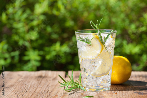 refreshing lemonade drink with rosemary in glasses