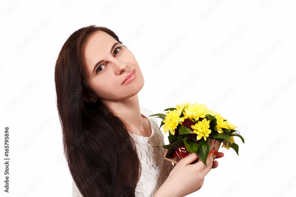 The girl the brunette holds yellow flowers