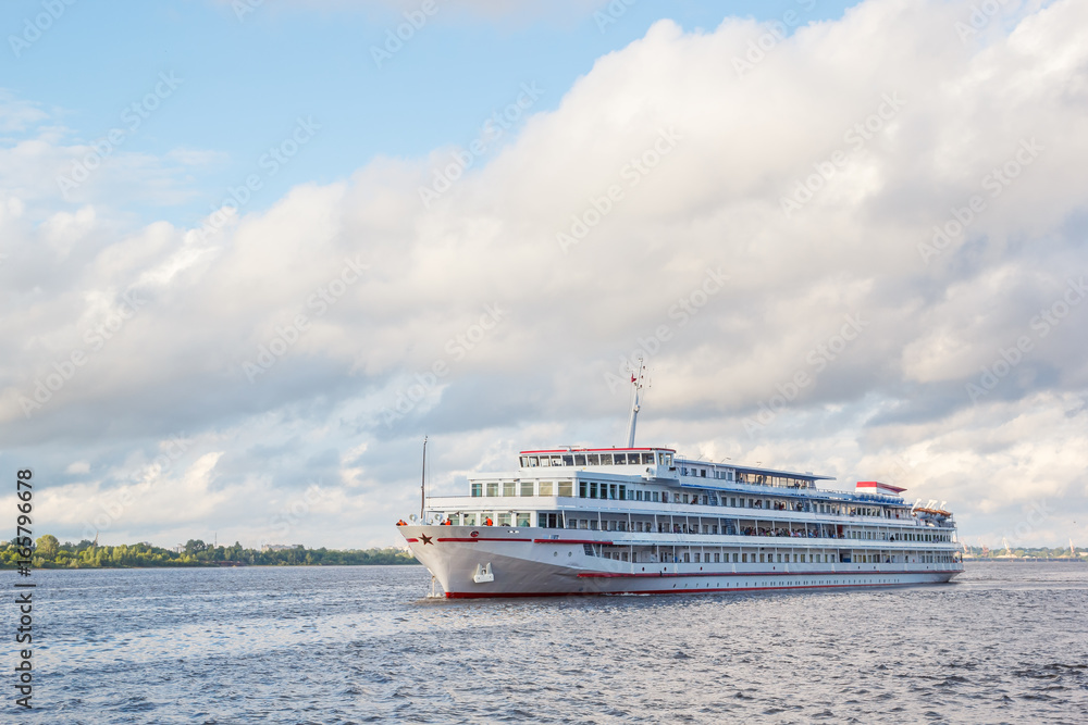 The four-deck ship goes along the river The four-deck ship goes along the river