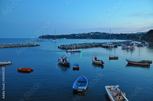 Boats and yachts near the island of Procida in the evening