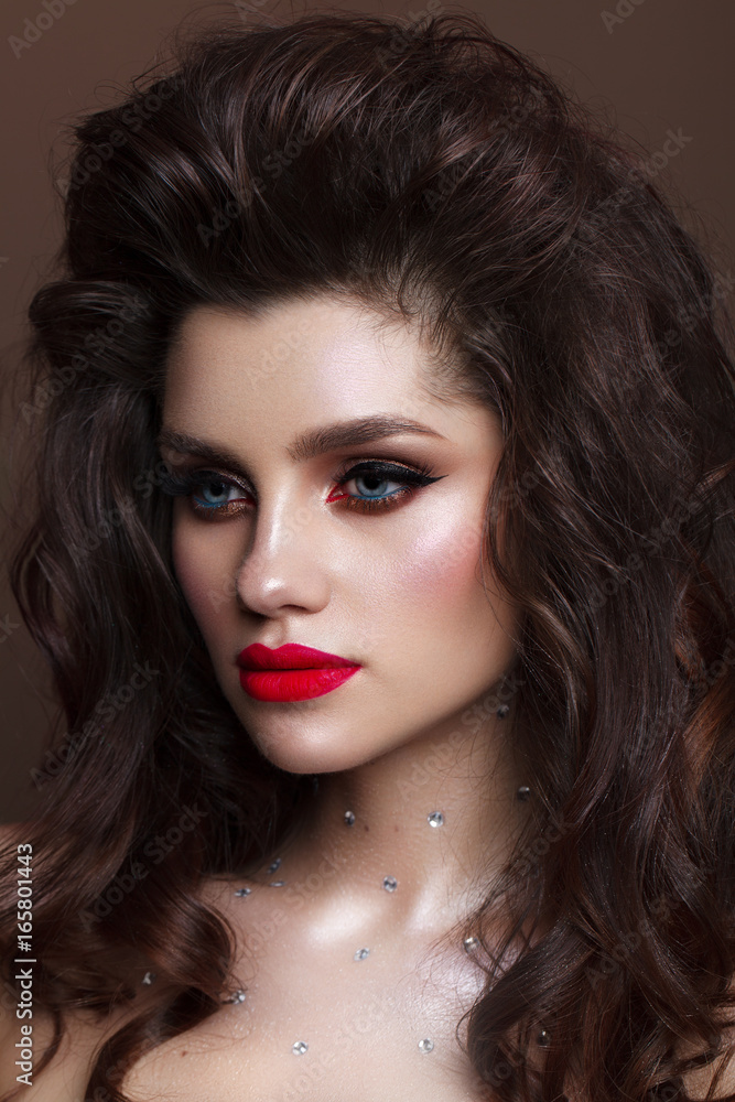 Beautiful young model with professional make up, perfect skin, volume hairdo. Red lips. Beautiful young model with professional make up, perfect skin, volume hairdo. Red lips.
