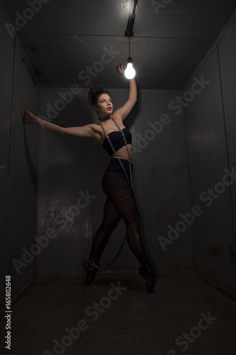 Sexy fetish ballerina in metal room.