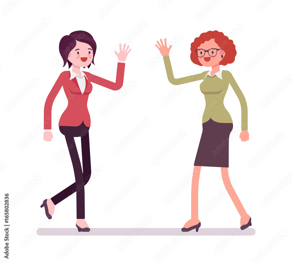 Businesswomen greeting with hands