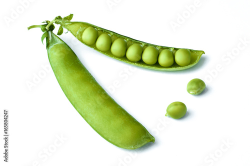 Two pods of green sweet peas, isolated on white