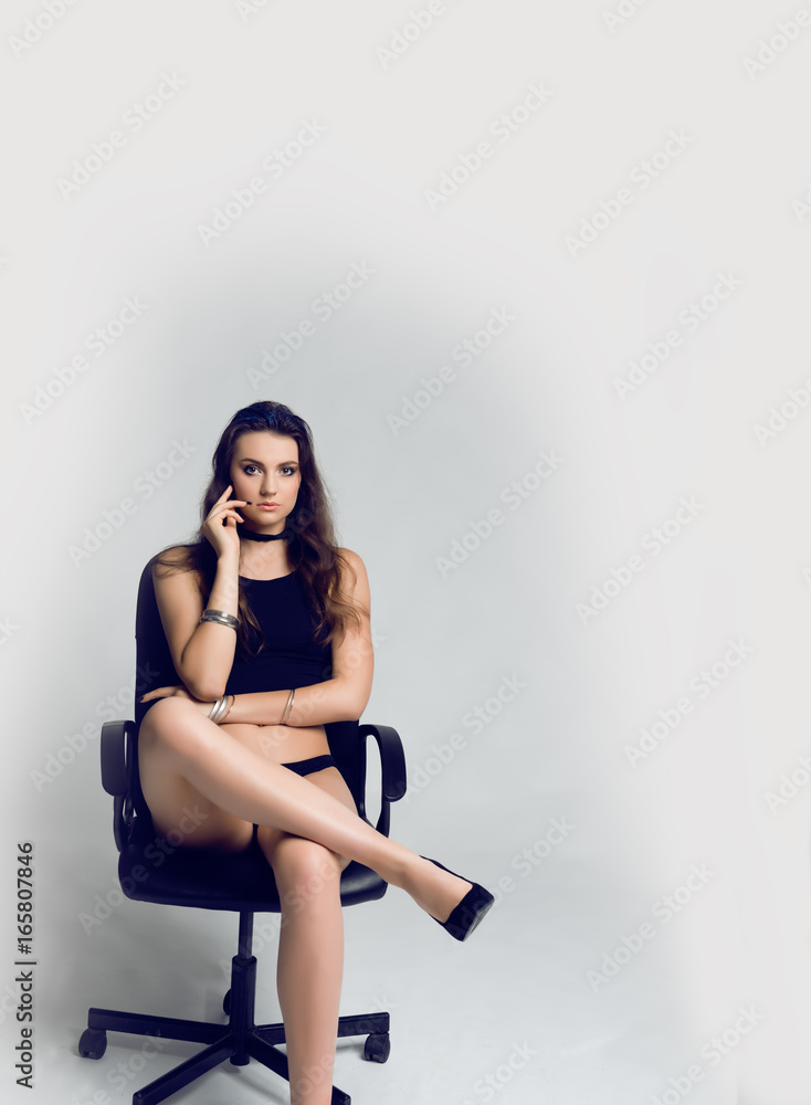 Beautiful, slim woman posing in alluring underwear on chair.Sexy lady in  elegant black bra.Fashion portrait of model indoors in lingerie. Stock  Photo | Adobe Stock