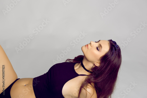 Beautiful, slim woman in alluring underwear lay down.Sexy lady in elegant black bra.Fashion portrait of model.