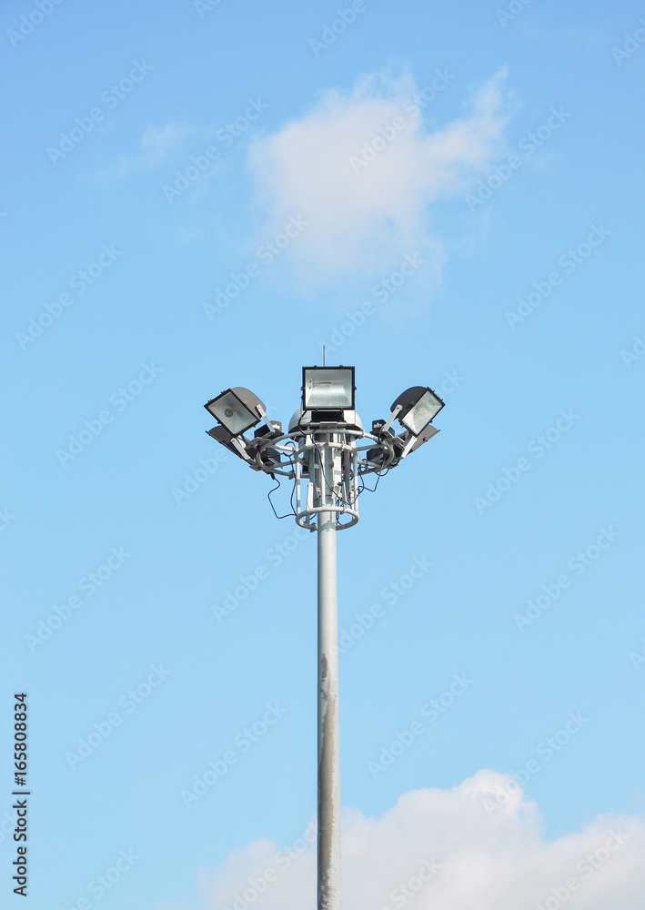 Spotlight with blue sky background Spotlight with blue sky background