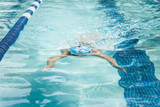 Young Female Swimming Breaststroke