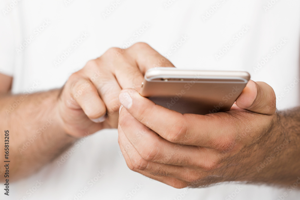 Close up of young man using a smartphone with copy space Close up of young man using a smartphone with copy space