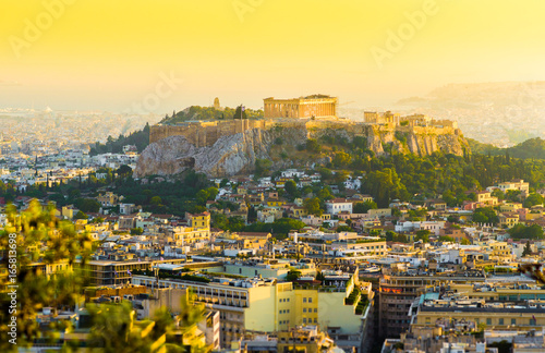 City of Athens with the ancient Acropolis in the center of the city on the sunset