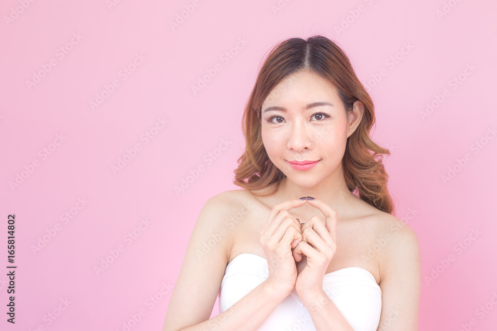 closeup beautiful korea woman face with attractive smiling, isolated on pink background, 20-30 year old. closeup beautiful korea woman face with attractive smiling, isolated on pink background, 20-30 year old.